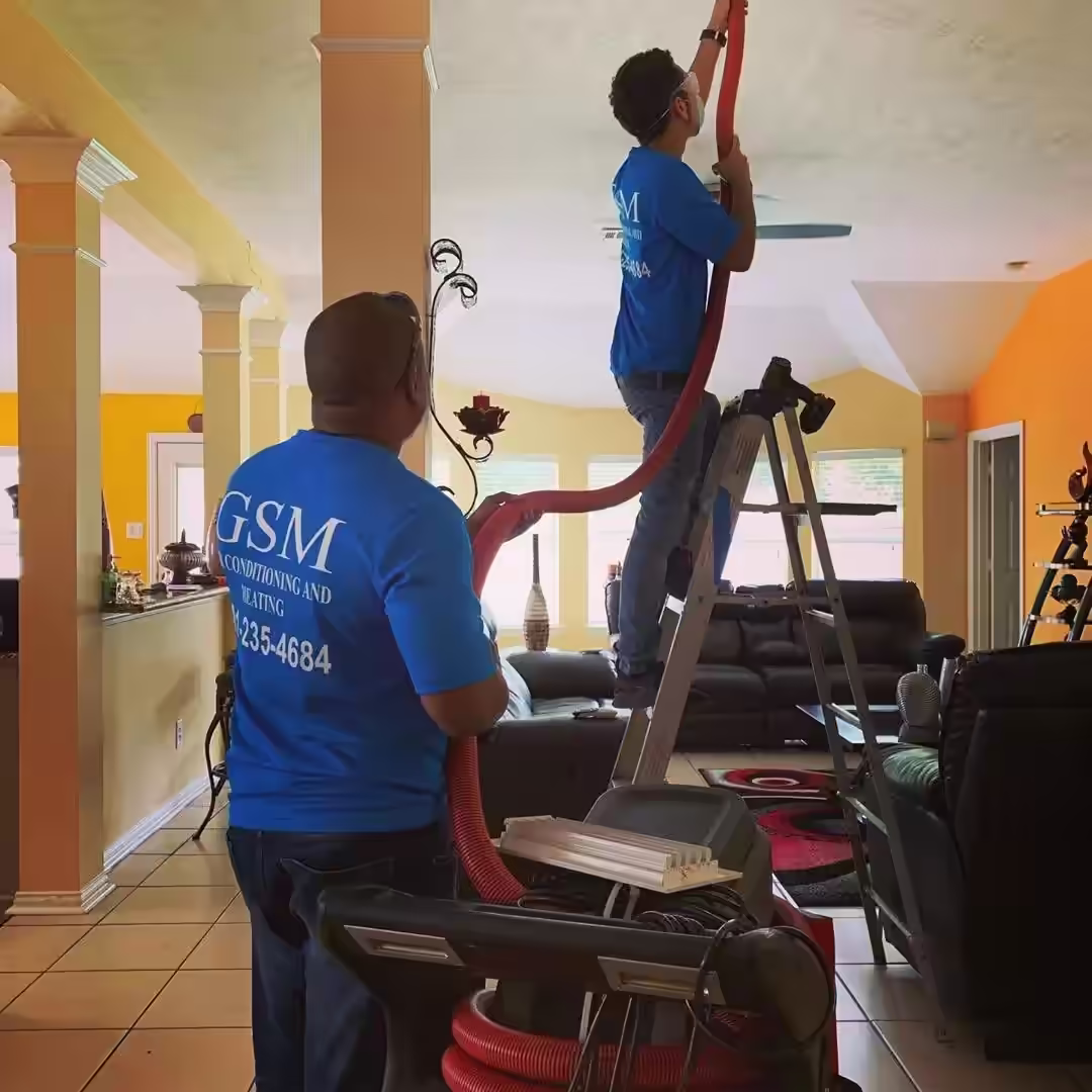 Professional HVAC technician installing air conditioning system in Cypress, Texas