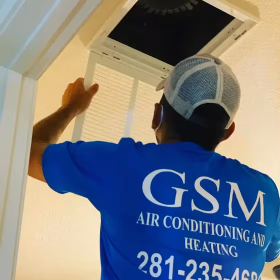 Licensed HVAC contractor inspecting air duct system